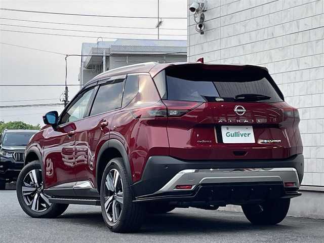 日産 エクストレイル G e－4ORCE 埼玉県 2024(令6)年 1.8万km 赤 ワンオーナー/NISMOエアロパーツ/キャメルレザー/パノラマサンルーフ/プロパイロット/パワーバックドア/パーキングアシスト/純正19インチアルミ/サイドステップ/全席シートヒーター/デジタルルームミラー/純正ナビTV/アラウンドビューモニター/ダウンヒルアシスト/LEDヘッドライト/FRコーナーセンサー/ハンドル支援/ETC/新車保証書/取扱説明書