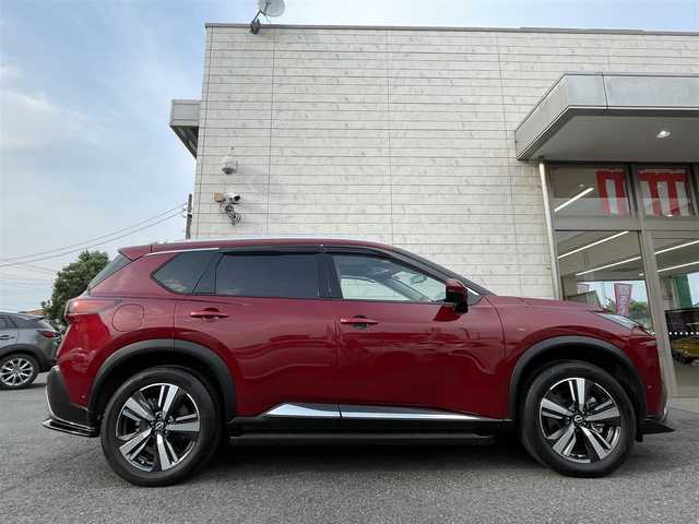 日産 エクストレイル G e－4ORCE 埼玉県 2024(令6)年 1.8万km 赤 ワンオーナー/NISMOエアロパーツ/キャメルレザー/パノラマサンルーフ/プロパイロット/パワーバックドア/パーキングアシスト/純正19インチアルミ/サイドステップ/全席シートヒーター/デジタルルームミラー/純正ナビTV/アラウンドビューモニター/ダウンヒルアシスト/LEDヘッドライト/FRコーナーセンサー/ハンドル支援/ETC/新車保証書/取扱説明書