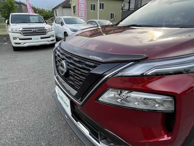 日産 エクストレイル G e－4ORCE 埼玉県 2024(令6)年 1.8万km 赤 ワンオーナー/NISMOエアロパーツ/キャメルレザー/パノラマサンルーフ/プロパイロット/パワーバックドア/パーキングアシスト/純正19インチアルミ/サイドステップ/全席シートヒーター/デジタルルームミラー/純正ナビTV/アラウンドビューモニター/ダウンヒルアシスト/LEDヘッドライト/FRコーナーセンサー/ハンドル支援/ETC/新車保証書/取扱説明書