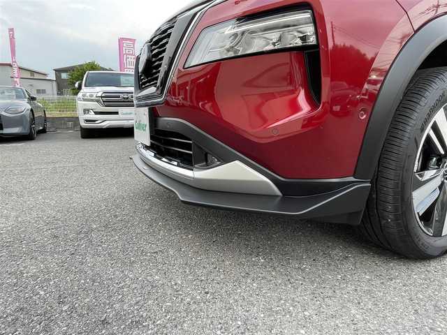 日産 エクストレイル G e－4ORCE 埼玉県 2024(令6)年 1.8万km 赤 ワンオーナー/NISMOエアロパーツ/キャメルレザー/パノラマサンルーフ/プロパイロット/パワーバックドア/パーキングアシスト/純正19インチアルミ/サイドステップ/全席シートヒーター/デジタルルームミラー/純正ナビTV/アラウンドビューモニター/ダウンヒルアシスト/LEDヘッドライト/FRコーナーセンサー/ハンドル支援/ETC/新車保証書/取扱説明書