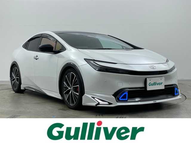 トヨタ プリウス Z 岡山県 2023(令5)年 3.7万km プラチナホワイトパールマイカ モデリスタエアロ /シグネチャーイルミ/パノラマルーフ /パノラミックビューモニター/純正12.3インチディスプレイオーディオ/ナビ/地デジ/Bluetooth/カープレイ/USB/合皮シート/シートヒーター /シートベンチレーション/パワーバックドア /セーフティセンス /レーダークルーズコントロール/LEDヘッドライト/ローダウン/アドバンスドパーク/BSM/ETC2.0/AC100V/デジタルインナーミラー/ステアリングヒーター