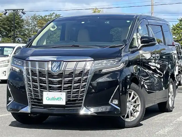 トヨタ アルファードハイブリット G Fパッケージ 道央・札幌 2022(令4)年 3.7万km ブラック ４WD/純正メーカーナビ/CD/DVD/BT/フルセグ/純正フリップダウンモニター/トヨタセーフティセンス/プリクラッシュセーフティ/横滑り防止装置/レーダークルーズコントロール/レーンキープアシスト/クリアランスソナー/ブラインドスポットモニター/パーキングブレーキサポート/リアクロストラフィックアラート/ロードサインアシスト/バックカメラ/ビルトインETC2.0/ドライブレコーダー/EVMODE/ECOMODE/両側パワースライドドア/パワーバックドア/前席/２列目パワーシート/D席メモリーシート/前席シートヒーター/前席エアシート/N席/２列目オットマン/レザーシート/革巻きウッドコンビステアリング/ステアリングリモコン/ハンドルヒーター/AC100V/電動パーキング/ブレーキホールド/デジタルインナーミラー/MTモード付AT/プッシュスタート/スマートキー/LEDヘッドライト/オートライト/オートハイビーム/フォグランプ/電動格納ミラー/ウィンカーミラー/純正フロアマット/ドアバイザー/スペアキー