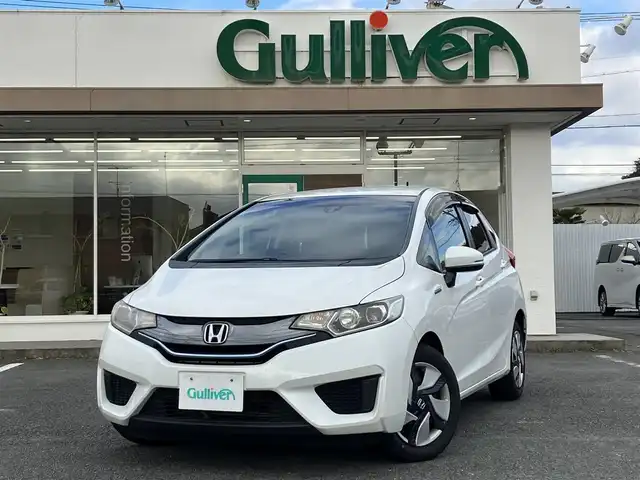 ホンダ フィット ハイブリット Lパッケージ 三重県 2015(平27)年 13.3万km ホワイトオーキッドパール ワンオーナー/♪シティブレーキアクティブシステム/♪誤発進抑制機能/♪純正ナビ/・フルセグ/・Bluetooth ・CD再生/・DVD再生/録音機能/♪バックカメラ/♪クルーズコントロール/♪ハーフレザーシート/♪LEDヘッドライト/♪オートライト/♪ステアリングスイッチ/♪オートリトラクタブルミラー/♪ウィンカーミラー/♪ビルトインETC/♪ドライブレコーダー