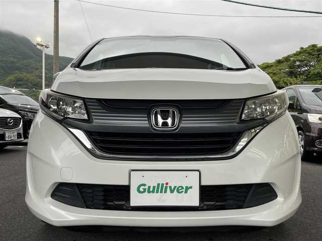 ホンダ フリード G 愛知県 2018(平30)年 6.4万km ホワイトオーキッドパール ワンオーナー/純正ナビ（フルセグ/CD/DVD/AM/FM/」BTオーディオ）/プッシュスタート/ステアリングリモコン/両側パワスラ/バックカメラ/電格ミラー/ドアバイザー/純正フロアマット/ビルトインETC/木目調インパネ/SRSエアバッグ/ビークルスタビリティアシスト/車線維持支援システム