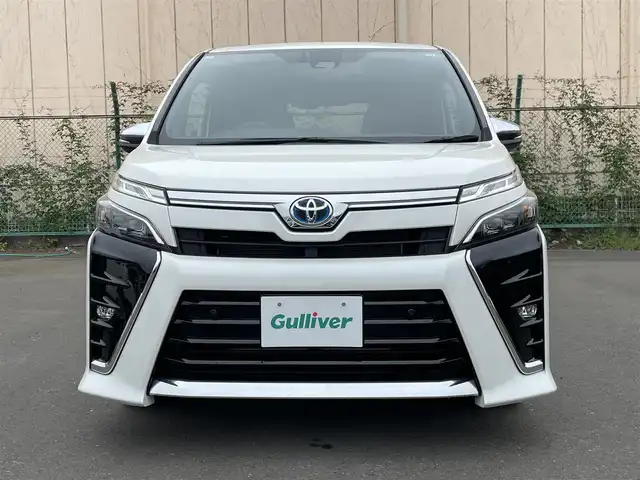 トヨタ ヴォクシー ハイブリッド ZS 煌Ⅱ 東京都 2020(令2)年 5.9万km ホワイトパールクリスタルシャイン アルパインナビ　/アルパイン後席モニター　/両側電動ドア　/シートヒーター　/ビルトインＥＴＣ　/前後ドラレコ　/クルーズコントロール　/フルセグＴＶ　/Ｂｌｕｅｔｏｏｔｈ　/ＬＥＤヘッド　/衝突被害　/レーンキープ
