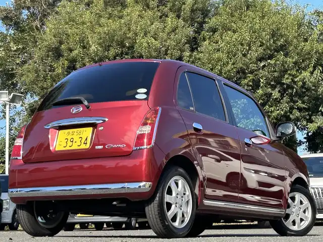 ダイハツ ミラ ジーノ プレミアムX 東京都 2008(平20)年 8.8万km ルージュレッドクリスタルメタリック フロントフォグランプ/MOMO製本木製ステアリングホイール/木目調シフトノブ/タン革/スエード調ファブリックコンビシート/carrozzeriaオーディオ（MVH-5600）/・Bluetoothオーディオ/AUX/FM/AM/ETC/取扱説明書/保証書