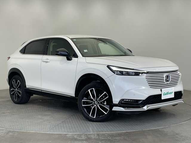 ホンダ ヴェゼル ハイブリッド e:HEV Z 栃木県 2021(令3)年 3.8万km プラチナホワイトパール 純正ナビ/(ワンセグTV/Bluetooth/SD/USB)/Honda SENSING/全方位カメラ/ETC2.0車載器/純正アルミホイール/ドライブレコーダー/禁煙車/ワイヤレス充電器/寒冷地仕様/運転席助手席シートヒーター/ハンズフリーアクセスパワーテールゲート/LEDシーケンシャルターンシグナルランプ/マルチビューカメラシステム/プレミアムオーディオ/コーナーセンサー/衝突軽減システム/横滑り防止装置/ダウンヒルアシストコントロール/スマートキー/プッシュスタート