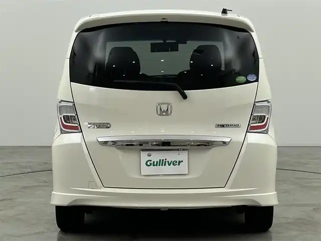 ホンダ フリード ハイブリット ジャストセレクション 福岡県 2013(平25)年 9万km プレミアムホワイトパール 社外パナソニックナビ（ＢＴ，フルセグＴＶ）　/ＥＴＣ　/前後ドライブレコーダー　/クルーズコントロール　/両側電動スライドドア　/横滑り防止装置　/フロントガラス熱線　/電動格納式ドアミラー　/純正１５インチＡＷ