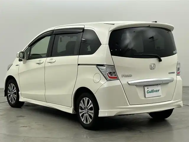 ホンダ フリード ハイブリット ジャストセレクション 福岡県 2013(平25)年 9万km プレミアムホワイトパール 社外パナソニックナビ（ＢＴ，フルセグＴＶ）　/ＥＴＣ　/前後ドライブレコーダー　/クルーズコントロール　/両側電動スライドドア　/横滑り防止装置　/フロントガラス熱線　/電動格納式ドアミラー　/純正１５インチＡＷ