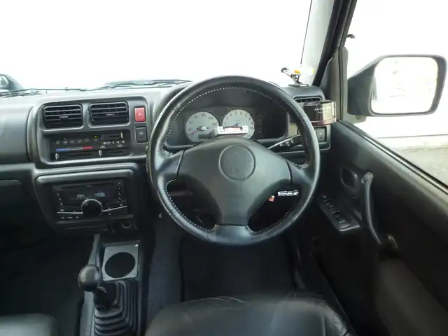 スズキ ジムニー ランドベンチャー 和歌山県 2003(平15)年 9.6万km グローブグリーンパールメタリック Clarion CDデッキ（CX-315）/　BT/CD/iPod/AUX/USB/5速MT/フォグランプ/電動格納ミラー/ドアバイザー/社外ETC/社外１６インチアルミ/取扱説明書/保証書