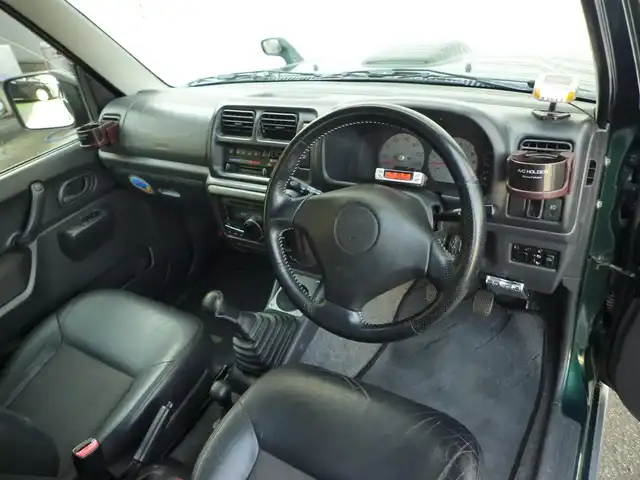 スズキ ジムニー ランドベンチャー 和歌山県 2003(平15)年 9.6万km グローブグリーンパールメタリック Clarion CDデッキ（CX-315）/　BT/CD/iPod/AUX/USB/5速MT/フォグランプ/電動格納ミラー/ドアバイザー/社外ETC/社外１６インチアルミ/取扱説明書/保証書