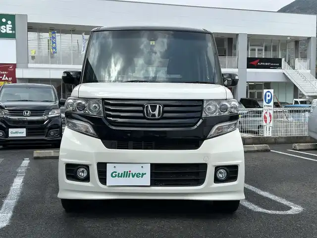 ホンダ Ｎ ＢＯＸ 2トーン カスタム G ターボAパッケージ 長崎県 2014(平26)年 7.7万km プレミアムホワイトパール ナビ取説/純正SDナビ/・AM/FM/・btオーディオ/・CD/DVD/・フルセグTV/バックカメラ/両側パワースライドドア/ステアリングスイッチ/フロアマット/ドアバイザー/CTBA/横滑り防止/パドルシフト/ETC