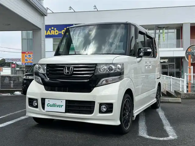 ホンダ Ｎ ＢＯＸ 2トーン カスタム G ターボAパッケージ 長崎県 2014(平26)年 7.7万km プレミアムホワイトパール ナビ取説/純正SDナビ/・AM/FM/・btオーディオ/・CD/DVD/・フルセグTV/バックカメラ/両側パワースライドドア/ステアリングスイッチ/フロアマット/ドアバイザー/CTBA/横滑り防止/パドルシフト/ETC