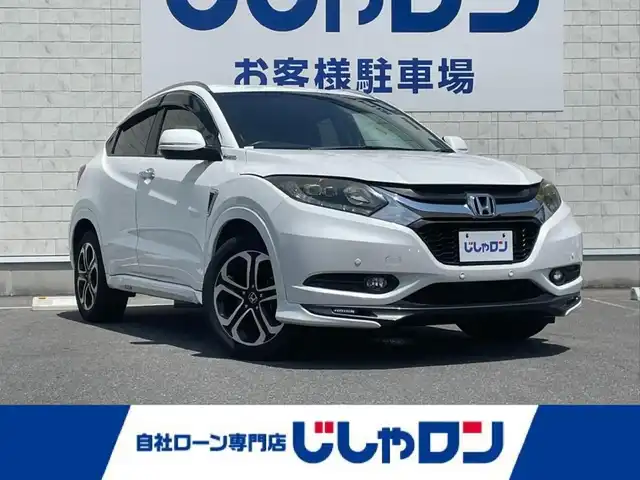 ホンダ ヴェゼル ハイブリッド Z 長崎県 2014(平26)年 11.6万km ホワイトオーキッドパール (株)IDOMが運営する【じしゃロン長崎店】の自社ローン専用車両になりますこちらは現金またはオートローンご利用時の価格です。自社ローンご希望の方は別途その旨お申付け下さい/ナビ　/バックカメラ　/ハーフレザーシート　/シートヒーター　/クルーズコントロール　/衝突被害軽減ブレーキ　/ＬＥＤヘッドライト　/オートライト　/パドルシフト　/ＥＴＣ　/コーナーセンサー　/プッシュスタート/スマートキー/電格ミラー