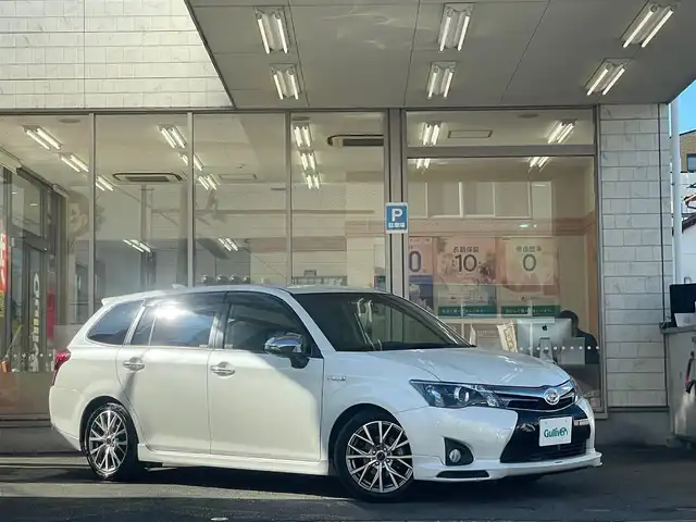 トヨタ カローラ フィールダー HV G エアロツアラー W×B 愛知県 2015(平27)年 11.1万km ホワイトパールクリスタルシャイン /当店買取/禁煙/TRDフロントエアロ//純正ナビNSZN-W64T/バックカメラ//フルセグTV/CD/SD/Bluetooth/DVD//社外ガングリップステアリング//社外マフラーガナドール//社外16AW//HID/Aライト/ハーフレザー//SRSカーテンエアバック//ISOFIX/純正Fマット/ドアバイザー//保証書/取説/ナビ取説/スマートキー//エアロ/ドラレコ