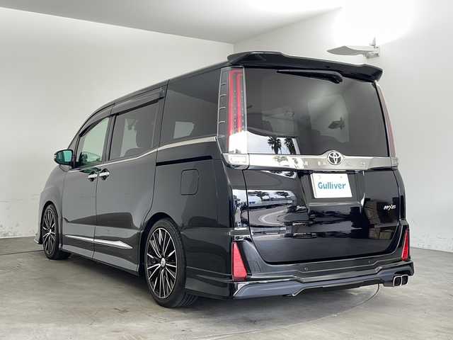 トヨタ ノア Si ダブルバイビーⅡ 兵庫県 2019(令1)年 2.3万km ブラック ・純正9インチナビ&TV&CD&DVD&BT&HDMI&SD/・純正12.1インチフリップダウンモニター/・両側パワースライドドア/・純正プレミアムサウンドシステム/・モデリスタ(フロント・サイド・リア)/・トヨタセーフティセンス/・プリクラッシュセーフティ/・レーンディパーチャーアラート/・クリアランスソナー/・オートマチックハイビーム/・LEDヘッドライト/・RAYS 18インチAW/・社外パーフェクトダンパー５Gスペシャル/・全長式車高調キット/・BRITZ スロットルコントローラー/・ルームミラー一体型レーダー探知機/・クルーズコントロール/・パーキングサポートブレーキ/・先行車発進告知/・ハーフレザーシート/・オットマン/・フォグランプ/・ビルトインETC2.0/・純正ドライブレコーダー/・プッシュスタート/・スペアキー/・ステアリングリモコン