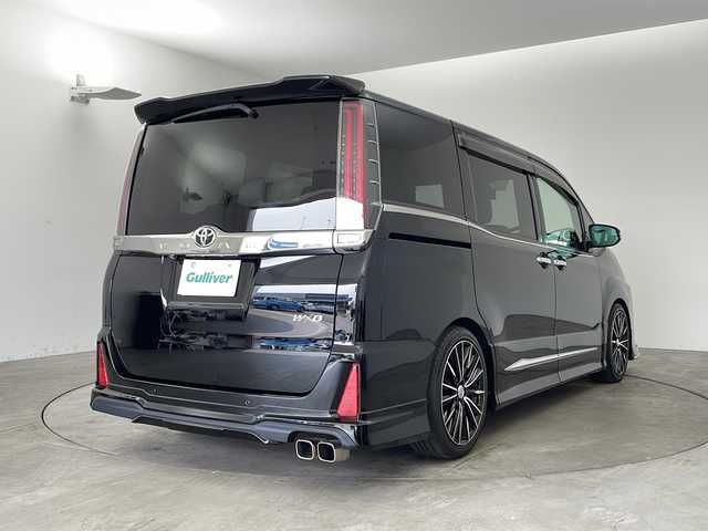 トヨタ ノア Si ダブルバイビーⅡ 兵庫県 2019(令1)年 2.3万km ブラック ・純正9インチナビ&TV&CD&DVD&BT&HDMI&SD/・純正12.1インチフリップダウンモニター/・両側パワースライドドア/・純正プレミアムサウンドシステム/・モデリスタ(フロント・サイド・リア)/・トヨタセーフティセンス/・プリクラッシュセーフティ/・レーンディパーチャーアラート/・クリアランスソナー/・オートマチックハイビーム/・LEDヘッドライト/・RAYS 18インチAW/・社外パーフェクトダンパー５Gスペシャル/・全長式車高調キット/・BRITZ スロットルコントローラー/・ルームミラー一体型レーダー探知機/・クルーズコントロール/・パーキングサポートブレーキ/・先行車発進告知/・ハーフレザーシート/・オットマン/・フォグランプ/・ビルトインETC2.0/・純正ドライブレコーダー/・プッシュスタート/・スペアキー/・ステアリングリモコン