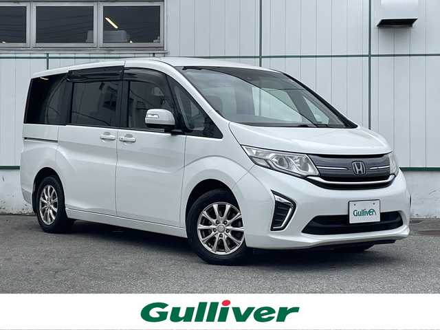 ホンダ ステップワゴン G 山梨県 2016(平28)年 14.3万km ホワイトオーキッドパール ワンオーナー/4WD/純正SDナビ(VXM-164CSi)/純正CD/DVD/Bluetooth接続/バックカメラ/純正ドライブレコーダー/両側電動スライドドア/ETC/衝突被害軽減システム/レーンキープアシスト/横滑り防止装置/取扱説明書/保証書