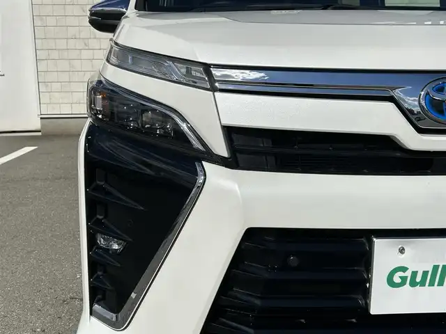 トヨタ ヴォクシー ハイブリッド ZS 煌Ⅲ 福岡県 2021(令3)年 2.5万km ホワイトパールクリスタルシャイン 純正10型メモリーナビ【フルセグTV・CD・DVD・HDMI】 バックモニター 後席モニター コーナーセンサー 両側パワスラ クルーズコントロール ドラレコ ビルトインETC2.0 シートヒーター スマートキー 純正LEDヘッドライト 純正フロアマット 純正アルミホイール プッシュスタート