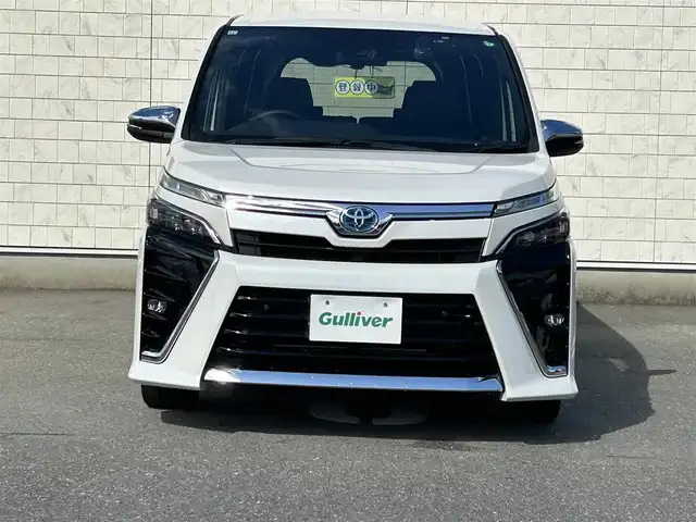 トヨタ ヴォクシー ハイブリッド ZS 煌Ⅲ 福岡県 2021(令3)年 2.5万km ホワイトパールクリスタルシャイン 純正10型メモリーナビ【フルセグTV・CD・DVD・HDMI】 バックモニター 後席モニター コーナーセンサー 両側パワスラ クルーズコントロール ドラレコ ビルトインETC2.0 シートヒーター スマートキー 純正LEDヘッドライト 純正フロアマット 純正アルミホイール プッシュスタート