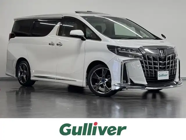 トヨタ アルファード S Cパッケージ 三重県 2018(平30)年 2.1万km ホワイトパールクリスタルシャイン ガソリン/FF/MTモード付インパネCVT/純正 10インチナビ NSZT-Z66T/（FM/AM/CD/DVD/TV/SD/SDREC/Bluetooth/USB/HDMI）/12.1インチ 後席モニター V12T-R66C/バックガイドモニター/モデリスタエアロ（F/S/R下）、スポーツマフラー、19インチAW/両側パワースライドドア/ドライブレコーダー 前方/ETC2.0/Toyota Safety Sense/・プリクラッシュセーフティ/・レーントレーシングアシスト/・クリアランスソナー/・パーキングサポートブレーキ/・アダプティブハイビームシステム/・レーダークルコン/・ロードサインアシスト/・先行車発進告知機能/など/装備/・ツインムーンルーフ*/・【DOP】電子インナーミラー/・合皮シート/・パワーシート（D/N）/・エグゼクティブパワーシート（電動リクライニング＆オットマン（N/2nd））/・パワーバックドア/・シートヒーター・ベンチレーション（D/N）/・ステアリングヒーター/・オートライト/・3眼LEDヘッドランプ/・左右・後席独立オートエアコン/・純正18AW/・保/取/ナビ取/・スマートキーx2/・社外セキュリティ付/・社外テールランプ（純正品車載）/など