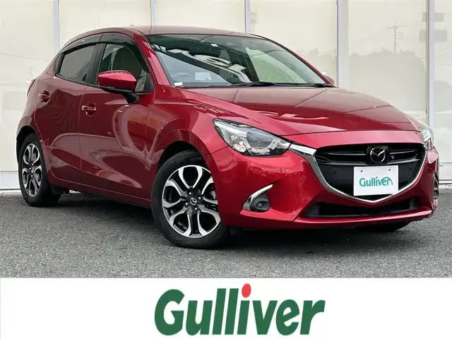 マツダ デミオ XD ツーリング 福岡県 2018(平30)年 2.7万km ソウルレッドクリスタルM ・マツダコネクトナビ/（BLUETOOTH/フルセグ/全周囲カメラ/・ETC/・ディーゼル車/・シートヒーター/・純正フロアマット/・アルミホイール/・交通標識認識システム/・クリアランスソナー/・レーンキープアシスト/・コーナーセンサー/・パノラミックビューモニター/・マルチビューモニター/・BSM/・SBS/・HUD/・プッシュスタート/・保証書/・取扱説明書
