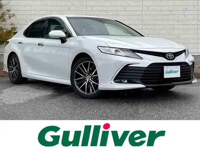 トヨタ カムリ G レザーパッケージ 滋賀県 2021(令3)年 7.4万km プラチナホワイトパールマイカ ワンオーナー/純正8インチナビ/(AM/FM/BT/USB/フルセグTV)/白革シート/シートヒーター/パワーシート/コーナーセンサー/ブラインドスポットモニター/ビルトインETC/ドライブレコーダー/バックカメラ/トヨタセーフティセンス/・プリクラッシュセーフティ/・レーントレーシングアシスト/・オートマチックハイビーム/・レーダークルーズコントロール/電動サンシェード/電動サイドブレーキ/オートホールド/オートライト/革巻きステアリング/ステアリングスイッチ/横滑り防止装置/積込スタッドレスタイヤ/プッシュスタート/電格ウインカーミラー