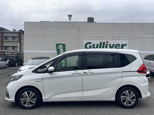 ホンダ フリード＋ ハイブリット G ホンダセンシング 東京都 2020(令2)年 3.7万km プラチナホワイトパール ワンオーナー/純正メモリナビ/（フルセグ/BT/CD/DVD/FM/AM）/アダプティブクルーズコントロール/車線維持支援システム/衝突軽減ブレーキ/誤発進抑制機能/両側パワースライドドア/コーナーセンサー/ハーフレザーシート/シートヒーター（D/N）/ミラーヒーター/スマートキー/ドライブレコーダー（前後）/ETC