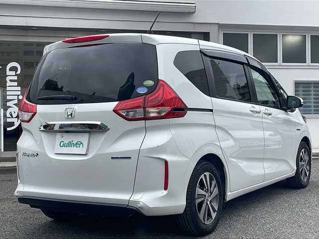 ホンダ フリード＋ ハイブリット G ホンダセンシング 東京都 2020(令2)年 3.7万km プラチナホワイトパール ワンオーナー/純正メモリナビ/（フルセグ/BT/CD/DVD/FM/AM）/アダプティブクルーズコントロール/車線維持支援システム/衝突軽減ブレーキ/誤発進抑制機能/両側パワースライドドア/コーナーセンサー/ハーフレザーシート/シートヒーター（D/N）/ミラーヒーター/スマートキー/ドライブレコーダー（前後）/ETC