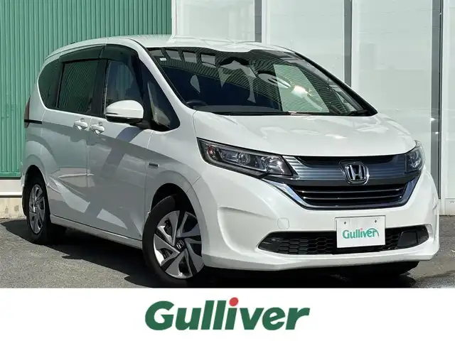 ホンダ フリード ハイブリット G ホンダセンシング 福岡県 2016(平28)年 9.2万km ホワイトオーキッドパール プッシュスタートボタン/スマートキー/クルーズコントロール/前方ドライブレコーダー/純正フロアマット/両側パワースライドドア/LEDヘッドライト/衝突軽減ブレーキ/Bluetoothオーディオ/バックカメラ/純正フロアマット