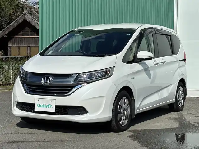 ホンダ フリード ハイブリット G ホンダセンシング 福岡県 2016(平28)年 9.2万km ホワイトオーキッドパール プッシュスタートボタン/スマートキー/クルーズコントロール/前方ドライブレコーダー/純正フロアマット/両側パワースライドドア/LEDヘッドライト/衝突軽減ブレーキ/Bluetoothオーディオ/バックカメラ/純正フロアマット