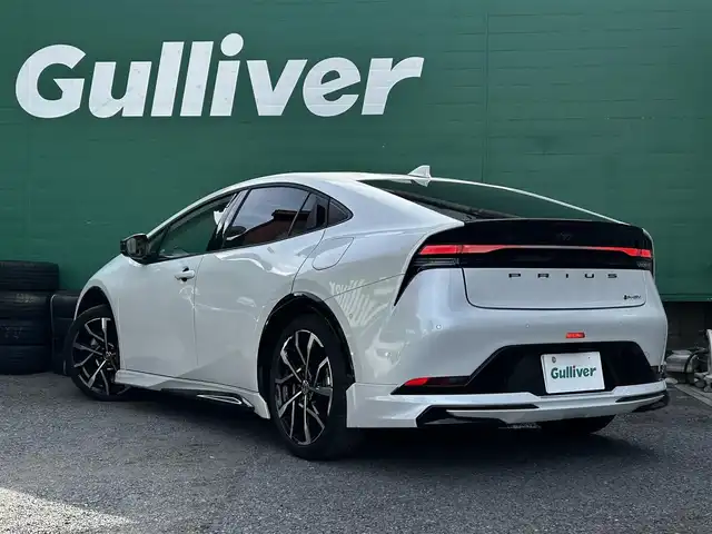 トヨタ プリウス Z 東京都 2023(令5)年 1.5万km プラチナホワイトパールマイカ ワンオーナー/モデリスタエアロ/デジタルインナーミラー/12.3型純正ナビ/(AM/FM/USB/BT/フルセグTV)/パノラミックビューモニター/ブラインドスポットモニター/Toyota Safety Sense/・衝突軽減ブレーキ/・レーダークルーズコントロール/・車線逸脱防止機能/トヨタチームメイト/・パーキングサポートブレーキ/前後ドライブレコーダー/運転席メモリ付パワーシート/前席シートヒータ/エアシート/純正19インチアルミ/ステアリングヒーター/スペアキー/ETC2.0/取扱説明書