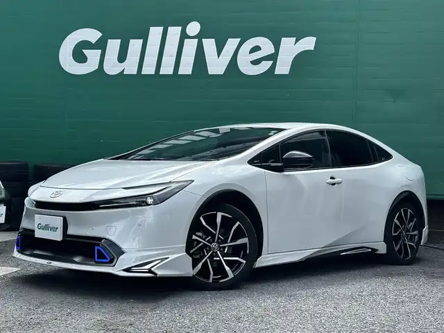 トヨタ プリウス Z 東京都 2023(令5)年 1.5万km プラチナホワイトパールマイカ ワンオーナー/モデリスタエアロ/デジタルインナーミラー/12.3型純正ナビ/(AM/FM/USB/BT/フルセグTV)/パノラミックビューモニター/ブラインドスポットモニター/Toyota Safety Sense/・衝突軽減ブレーキ/・レーダークルーズコントロール/・車線逸脱防止機能/トヨタチームメイト/・パーキングサポートブレーキ/前後ドライブレコーダー/運転席メモリ付パワーシート/前席シートヒータ/エアシート/純正19インチアルミ/ステアリングヒーター/スペアキー/ETC2.0/取扱説明書