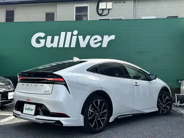 トヨタ プリウス Z 東京都 2023(令5)年 1.5万km プラチナホワイトパールマイカ ワンオーナー/モデリスタエアロ/デジタルインナーミラー/12.3型純正ナビ/(AM/FM/USB/BT/フルセグTV)/パノラミックビューモニター/ブラインドスポットモニター/Toyota Safety Sense/・衝突軽減ブレーキ/・レーダークルーズコントロール/・車線逸脱防止機能/トヨタチームメイト/・パーキングサポートブレーキ/前後ドライブレコーダー/運転席メモリ付パワーシート/前席シートヒータ/エアシート/純正19インチアルミ/ステアリングヒーター/スペアキー/ETC2.0/取扱説明書