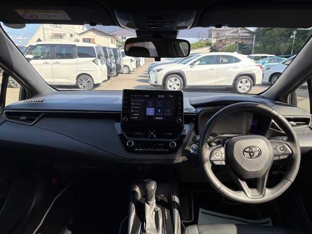 トヨタ カローラツーリング ハイブリッド ダブルバイビー 大阪府 2021(令3)年 4.4万km ブラックマイカ 純正9型ディスプレイオーディオナビ/バックカメラ/フルセグ/ブラインドスポットモニター/トヨタセーフティセンス/シートヒーター/ステアリングヒーター/ハーフレザーシート/純正アルミホイール/ビルトインETC/LEDヘッドライト/プッシュスタート/スマートキー
