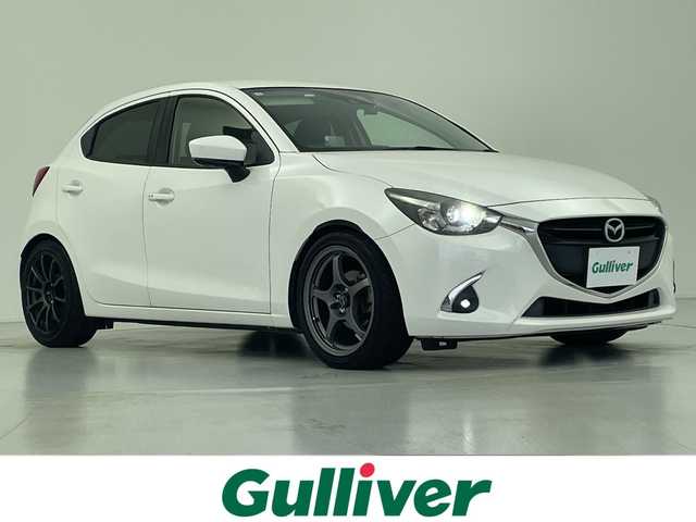 マツダ デミオ XD ツーリング 愛知県 2017(平29)年 6.2万km スノーフレイクホワイトパールマイカ 純正マツダコネクトナビ・フルセグTV/CD・DVD・Bluetooth再生/バックカメラ/純正LEDヘッドライト/ブラインドスポットモニター/ヘッドアップディスプレイ/ドライブレコーダー/社外１７インチAW/ローダウン/Greddyマフラー/セーフティパッケージ