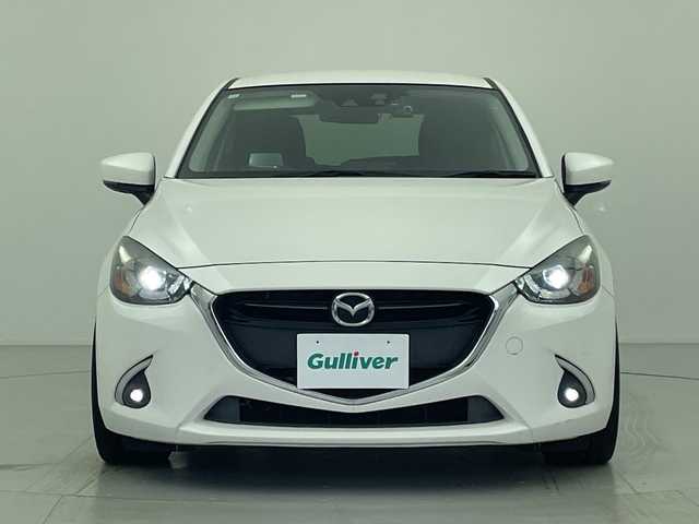 マツダ デミオ XD ツーリング 愛知県 2017(平29)年 6.2万km スノーフレイクホワイトパールマイカ 純正マツダコネクトナビ・フルセグTV/CD・DVD・Bluetooth再生/バックカメラ/純正LEDヘッドライト/ブラインドスポットモニター/ヘッドアップディスプレイ/ドライブレコーダー/社外１７インチAW/ローダウン/Greddyマフラー/セーフティパッケージ