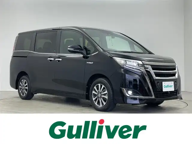 トヨタ エスクァイア ハイブリッド Gi プレミアムパッケージ ブラックテーラード 埼玉県 2019(令1)年 5.9万km ブラック アルパイン11インチナビ/フルセグテレビ/CD/DVD/BT/HDMI/バックカメラ/ETC/アルパイン11インチフリップダウン/クルーズコントロール/トヨタセーフティセンス/プリクラッシュセーフティー/LEDライト/LEDフォグ/オートハイビーム/クリアランスソナー/ハーフレザーシート/シートヒーター（F/R）/ステアリングリモコン/ウッドコンビステアリング