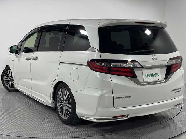ホンダ オデッセイ ハイブリッド アブソルート ホンダセンシング 広島県 2020(令2)年 4.1万km プラチナホワイトパール 純正9型ナビ/両側パワースライドドア/TEIN車高調/バックモニター/パワーシート/ハーフレザーシート/オットマン/ホンダセンシング/・衝突軽減ブレーキ/・レーンキープアシスト/・アダプティブクルーズコントロール/・誤発進抑制機能/LEDヘッドランプ/オートライト/純正17インチAW/ETC2.0/前後ドライブレコーダー