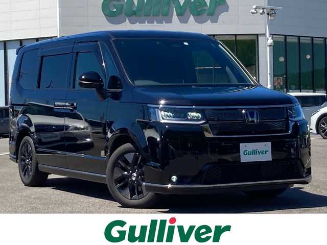 ホンダ ステップワゴン スパーダ eHEV 佐賀県 2023(令5)年 1.3万km クリスタルブラックパール 純正11.4インチナビ/マルチビューカメラ/アダプティブクルーズコントロール/衝突被害軽減ブレーキ/クリアランスソナー/ブラインドスポットモニター/車線逸脱警報機能/SOSコール/両側パワースライドドア/電動パーキングブレーキ/オートブレーキホールド/ETC/パワーバックドア/ハーフレザーシート/シートヒーター/オットマン/シートバックテーブル/ステアリングリモコン/レザーステアリング/LEDヘッドライト/フォグライト/純正アルミホイール