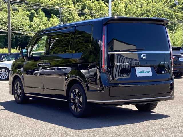 ホンダ ステップワゴン スパーダ eHEV 佐賀県 2023(令5)年 1.3万km クリスタルブラックパール 純正11.4インチナビ/マルチビューカメラ/アダプティブクルーズコントロール/衝突被害軽減ブレーキ/クリアランスソナー/ブラインドスポットモニター/車線逸脱警報機能/SOSコール/両側パワースライドドア/電動パーキングブレーキ/オートブレーキホールド/ETC/パワーバックドア/ハーフレザーシート/シートヒーター/オットマン/シートバックテーブル/ステアリングリモコン/レザーステアリング/LEDヘッドライト/フォグライト/純正アルミホイール