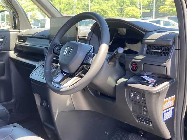 ホンダ ステップワゴン スパーダ eHEV 佐賀県 2023(令5)年 1.3万km クリスタルブラックパール 純正11.4インチナビ/マルチビューカメラ/アダプティブクルーズコントロール/衝突被害軽減ブレーキ/クリアランスソナー/ブラインドスポットモニター/車線逸脱警報機能/SOSコール/両側パワースライドドア/電動パーキングブレーキ/オートブレーキホールド/ETC/パワーバックドア/ハーフレザーシート/シートヒーター/オットマン/シートバックテーブル/ステアリングリモコン/レザーステアリング/LEDヘッドライト/フォグライト/純正アルミホイール