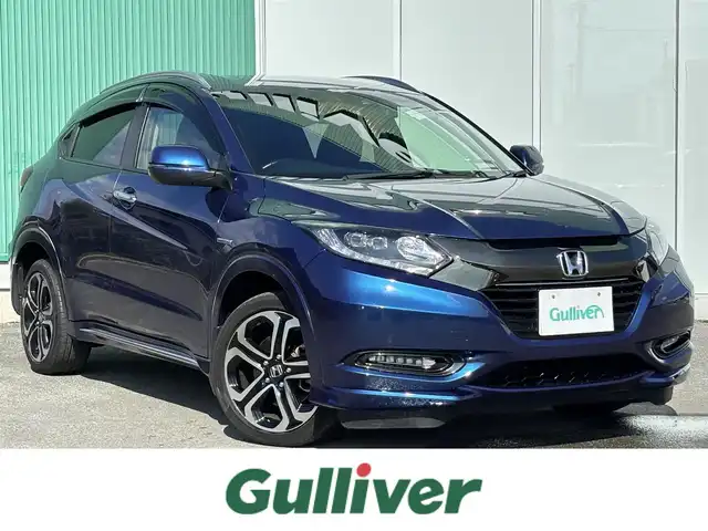 ホンダ ヴェゼル ハイブリッド 福岡県 2016(平28)年 8万km 青 純正ナビ(ワンセグテレビ・CD・DVD・BT)/・VXM-174VFi/バックカメラ/ETC/純正アルミホイール/前席シートヒーター/プッシュスタート/社外フロアマット/スマートキー