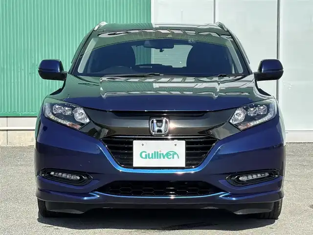 ホンダ ヴェゼル ハイブリッド 福岡県 2016(平28)年 8万km 青 純正ナビ(ワンセグテレビ・CD・DVD・BT)/・VXM-174VFi/バックカメラ/ETC/純正アルミホイール/前席シートヒーター/プッシュスタート/社外フロアマット/スマートキー