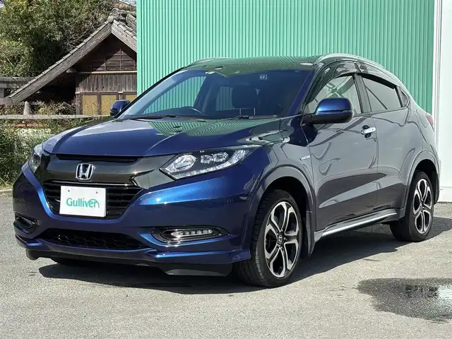 ホンダ ヴェゼル ハイブリッド 福岡県 2016(平28)年 8万km 青 純正ナビ(ワンセグテレビ・CD・DVD・BT)/・VXM-174VFi/バックカメラ/ETC/純正アルミホイール/前席シートヒーター/プッシュスタート/社外フロアマット/スマートキー