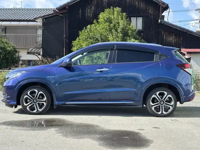 ホンダ ヴェゼル ハイブリッド 福岡県 2016(平28)年 8万km 青 純正ナビ(ワンセグテレビ・CD・DVD・BT)/・VXM-174VFi/バックカメラ/ETC/純正アルミホイール/前席シートヒーター/プッシュスタート/社外フロアマット/スマートキー