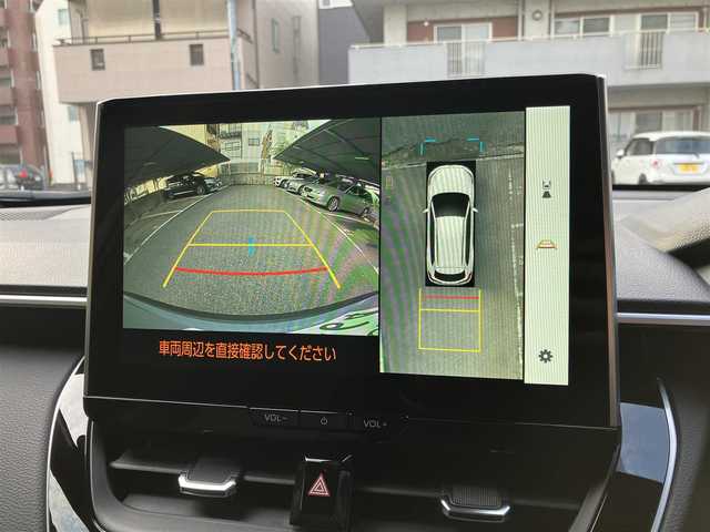 トヨタ カローラ クロス ハイブリッド Z 広島県 2024(令6)年 0.1万km未満 セメントグレーメタリック 走行距離50km（入庫時）/新車ワンオーナー/パノラマルーフ（MOP）/純正18インチダークグレーメタリック塗装アルミホイール/純正LEDヘッドランプ/純正LEDシーケンシャルターンランプ/純正LEDフロントフォグランプ/ルーフレール/ハンズフリーパワーバックドア/純正ハーフレザーシート/運転席パワーシート/運転席＆助手席シートヒーター/10.5インチディスプレイオーディオ（MOP）/・ナビゲーション/・ドライブレコーダー録画機能/・ETC2.0/・AppleCarPlay/・AndroidAuto/・Bluetooth/パノラミックビューモニター（MOP）/トヨタチームメイト【アドバンスドパーク】（MOP）/パーキングサポートブレーキ/ブラインドスポットモニター（MOP）/安心降車アシスト（MOP）/セーフティセンス（衝突回避支援パッケージ）/・プリクラッシュセーフティ/・レーントレーシングアシスト/・レーンディパーチャーアラート/・レーダークルーズコントロール/・オートマチックハイビーム/・ロードサインアシストなど/スマートキー×2/新車保障書有/取扱説明書有/MOPはメーカーオプションの略です