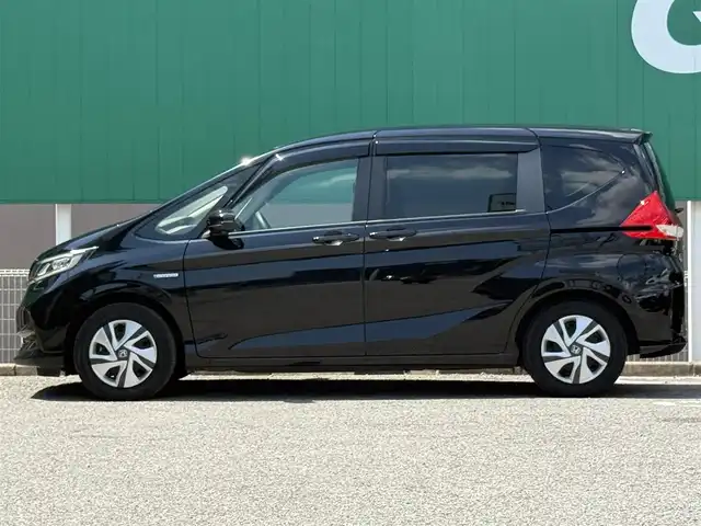ホンダ フリード ハイブリット G ホンダセンシング 千葉県 2020(令2)年 6.7万km クリスタルブラックパール 純正SDナビ(フルセグTV/CD/DVD/Bluetooth)/両側パワースライドドア/レーダークルーズコントロール/ホンダセンシング/バックカメラ/ビルトインETC/純正LEDヘッドライト/純正フロアマット/オートライト/ステアリングスイッチ/スマートキー/プッシュエンジンスタート
