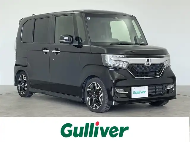 ホンダ Ｎ ＢＯＸ カスタム G L ターボ ホンダセンシング 大分県 2017(平29)年 1.9万km クリスタルブラックパール 純正SDナビ（VXU-185NBi）/Bluetooth/CD/DVD/フルセグ/TEINサスペンション/両側パワースライドドア/バックカメラ/コーナーセンサー/レーダークルーズコントロール/アイドリングストップ/MTモード/レーンキープアシスト/オートライト/オートマチックハイビーム/ベンチシート/純正フロアマット/純正アルミホイル15インチ/ビルトインETC