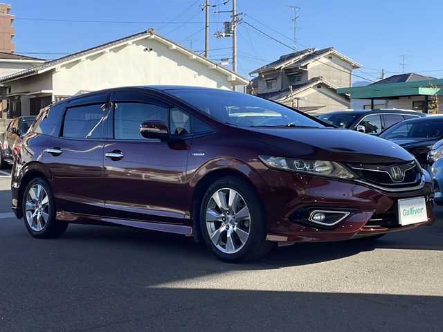 ホンダ ジェイド ハイブリッド X 愛媛県 2015(平27)年 8.9万km プレミアムディープロッソパール 純正ナビ/バックカメラ/ETC/ワンセグテレビ/Bluetooth接続/ワンオーナー/純正フロアマット/３列シート/ドライブレコーダー/ハーフレザーシート/レーンキープアシスト/衝突被害軽減システム/２列目エアコン/アイドリングストップ/純正アルミホイール/スマートキー/オートライト